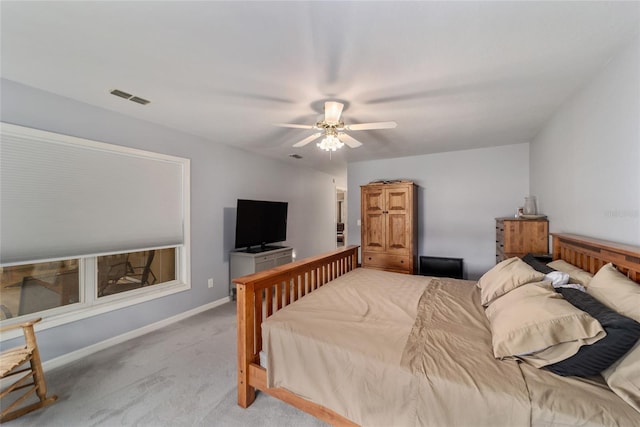 bedroom with visible vents, a ceiling fan, baseboards, and carpet floors