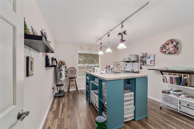kitchen featuring open shelves, baseboards, dark wood-type flooring, and blue cabinets