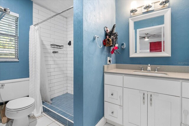 full bathroom with vanity, tile patterned floors, a stall shower, and toilet