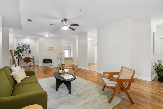 339 NE 2nd Ave, Gainesville, FL 32601 - living area with baseboards, ceiling fan, visible vents, and light wood-style flooring