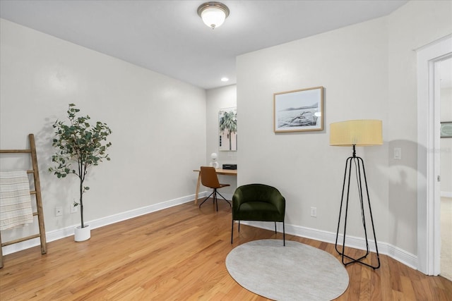339 NE 2nd Ave, Gainesville, FL 32601 - living area with light wood-type flooring and baseboards