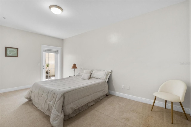 339 NE 2nd Ave, Gainesville, FL 32601 - bedroom with light colored carpet and baseboards