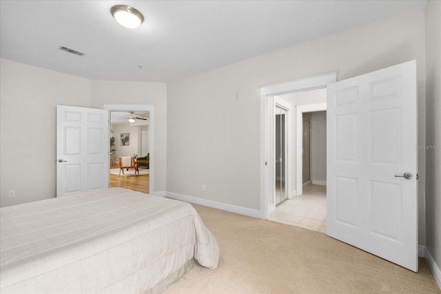 339 NE 2nd Ave, Gainesville, FL 32601 - bedroom with light colored carpet, baseboards, and visible vents