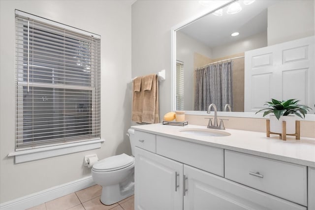 339 NE 2nd Ave, Gainesville, FL 32601 - full bathroom with vanity, toilet, tile patterned floors, baseboards, and curtained shower