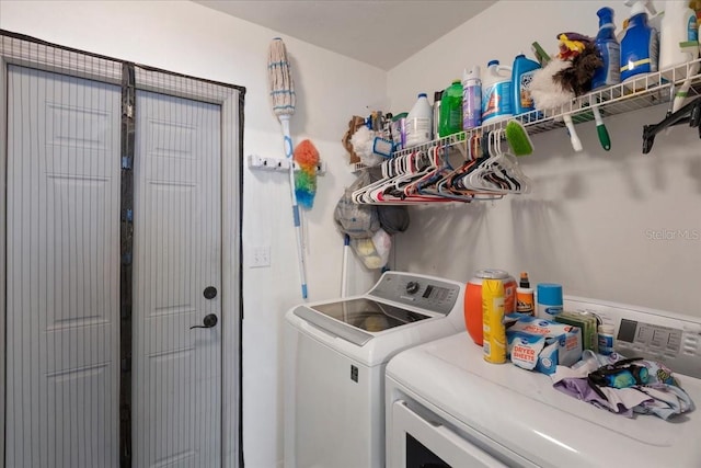laundry room with washer and clothes dryer and laundry area