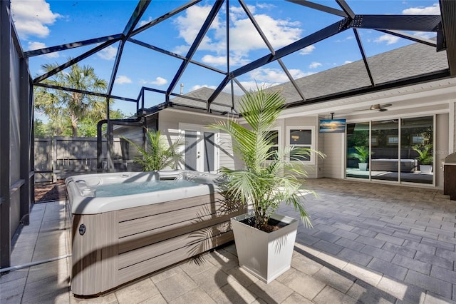 555 NW 134th Way, Newberry, FL 32669 - view of patio / terrace with a hot tub, ceiling fan, and glass enclosure