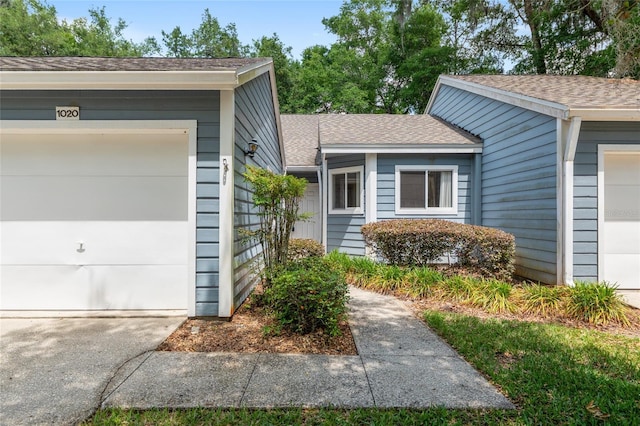 1020 NW 124th Dr, Newberry, FL 32669 - entrance to property with a shingled roof and a garage