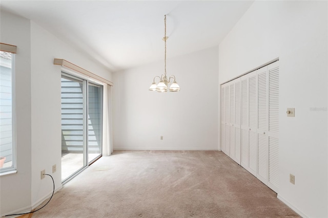 1020 NW 124th Dr, Newberry, FL 32669 - unfurnished dining area with carpet floors, healthy amount of natural light, a chandelier, and baseboards