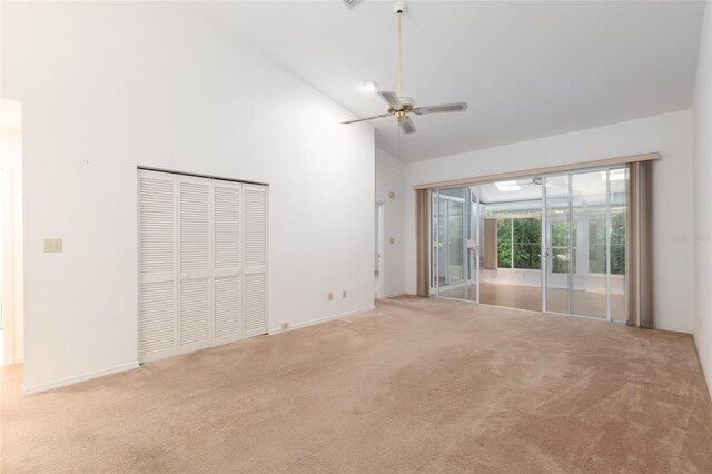 1020 NW 124th Dr, Newberry, FL 32669 - unfurnished bedroom featuring carpet floors, access to outside, high vaulted ceiling, a closet, and ceiling fan