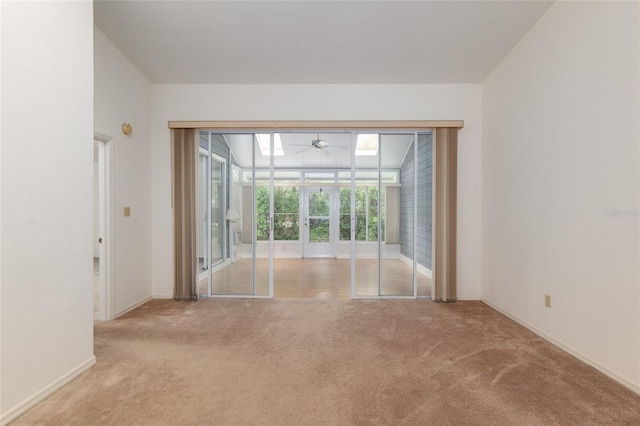 1020 NW 124th Dr, Newberry, FL 32669 - unfurnished room featuring a ceiling fan, carpet flooring, baseboards, and a sunroom