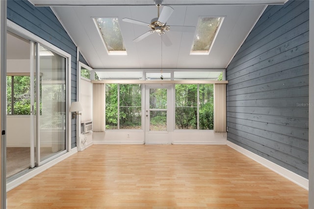 1020 NW 124th Dr, Newberry, FL 32669 - unfurnished sunroom featuring a skylight, lofted ceiling, healthy amount of natural light, wood finished floors, and wood walls
