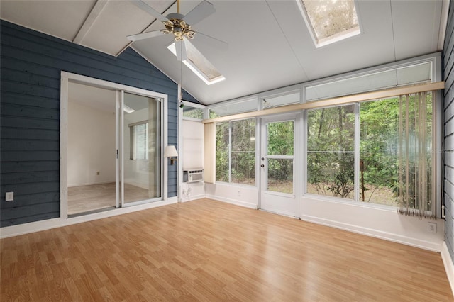 1020 NW 124th Dr, Newberry, FL 32669 - unfurnished sunroom featuring a skylight, lofted ceiling, wood finished floors, healthy amount of natural light, and baseboards