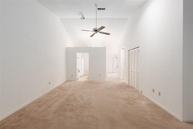 1020 NW 124th Dr, Newberry, FL 32669 - unfurnished living room with ceiling fan, light colored carpet, and a towering ceiling