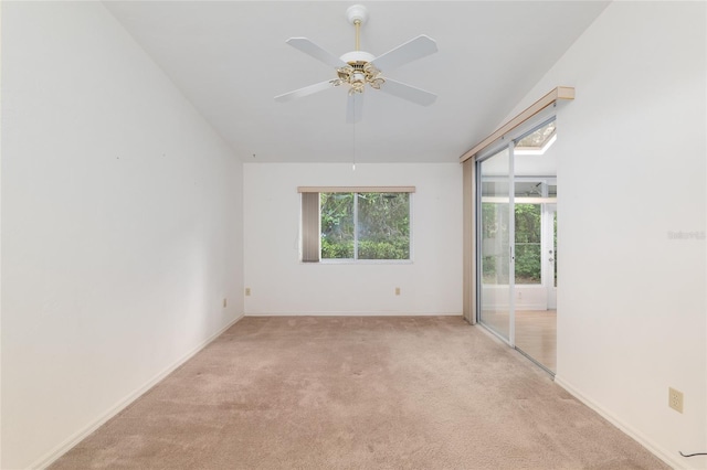 1020 NW 124th Dr, Newberry, FL 32669 - empty room featuring light carpet, a ceiling fan, and baseboards