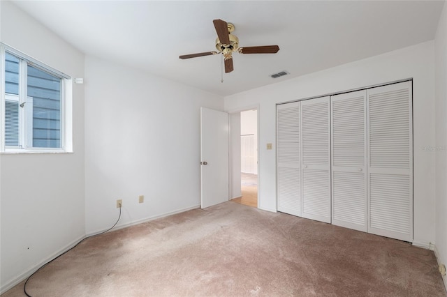 1020 NW 124th Dr, Newberry, FL 32669 - unfurnished bedroom featuring carpet flooring, a closet, a ceiling fan, and baseboards