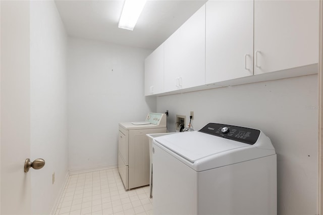 1020 NW 124th Dr, Newberry, FL 32669 - laundry room featuring cabinet space, washing machine and dryer, and baseboards
