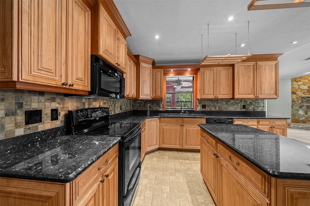 kitchen with a kitchen island, backsplash, a sink, black appliances, and dark stone countertops