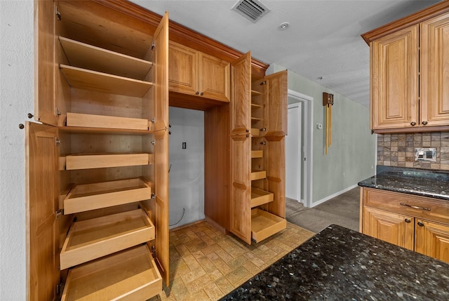 interior space featuring visible vents and baseboards