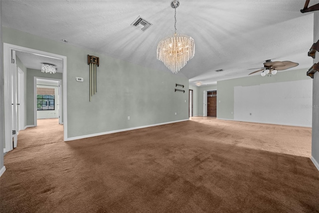 unfurnished living room with baseboards, carpet, ceiling fan with notable chandelier, and visible vents