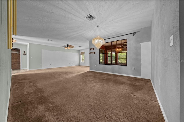 unfurnished living room with visible vents, baseboards, a textured ceiling, carpet flooring, and ceiling fan with notable chandelier