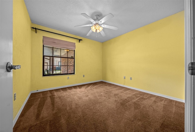 unfurnished room with a ceiling fan, baseboards, carpet, and a textured ceiling