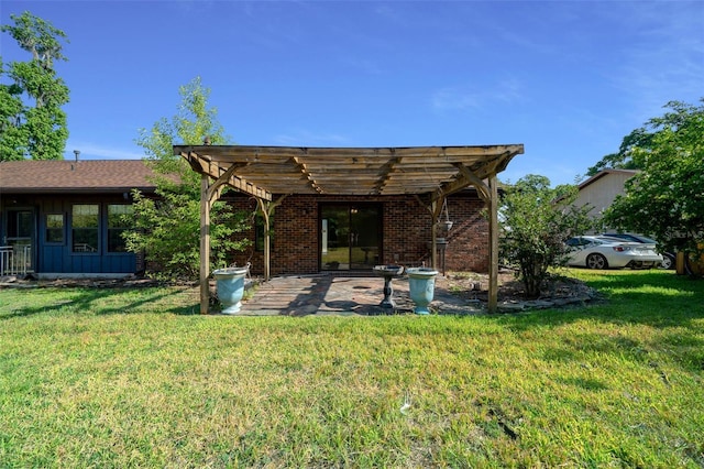 exterior space with a patio, board and batten siding, a yard, and a pergola