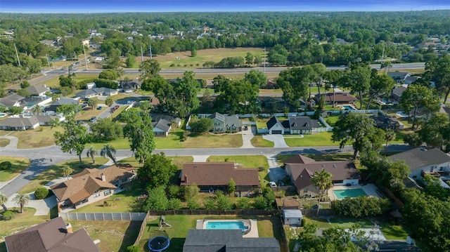 bird's eye view with a wooded view and a residential view