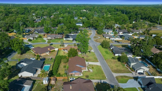 bird's eye view with a forest view and a residential view