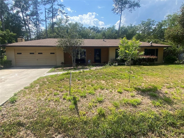3900 NW 21st Ter, Gainesville, FL 32605 - single story home with a front lawn, driveway, a garage, and a chimney