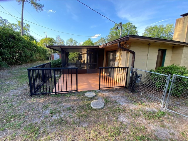 3900 NW 21st Ter, Gainesville, FL 32605 - view of front of home featuring fence, a chimney, concrete block siding, and a gate