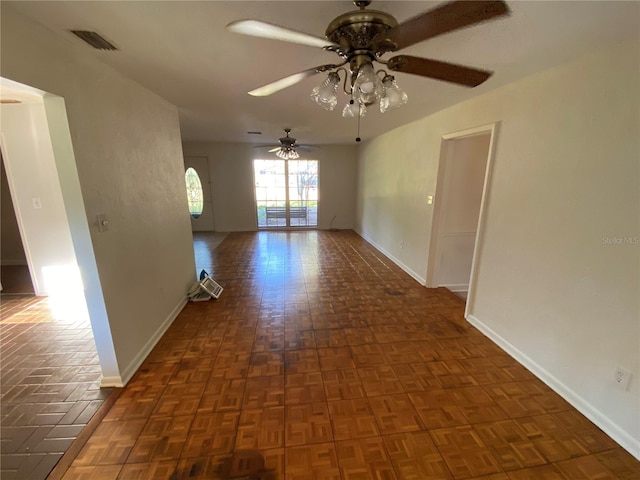 3900 NW 21st Ter, Gainesville, FL 32605 - spare room featuring baseboards, visible vents, and a ceiling fan