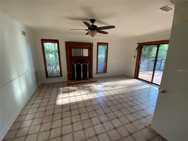 3900 NW 21st Ter, Gainesville, FL 32605 - unfurnished living room with visible vents, a healthy amount of sunlight, and ceiling fan
