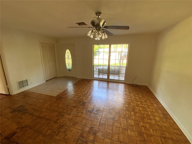 3900 NW 21st Ter, Gainesville, FL 32605 - interior space with visible vents, ceiling fan, and baseboards