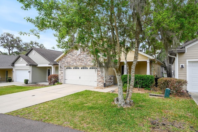 1488 NW 120th Way, Gainesville, FL 32606 - view of front facade featuring an attached garage, stone siding, driveway, and a front yard