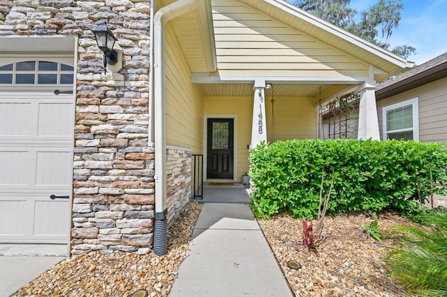1488 NW 120th Way, Gainesville, FL 32606 - doorway to property with covered porch and stone siding