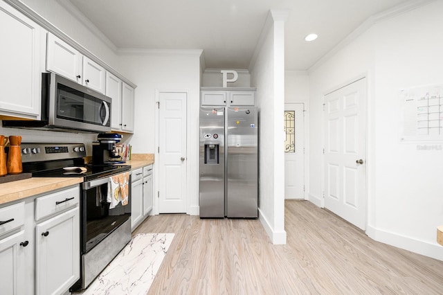 1488 NW 120th Way, Gainesville, FL 32606 - kitchen featuring appliances with stainless steel finishes, light countertops, baseboards, light wood-style floors, and ornamental molding
