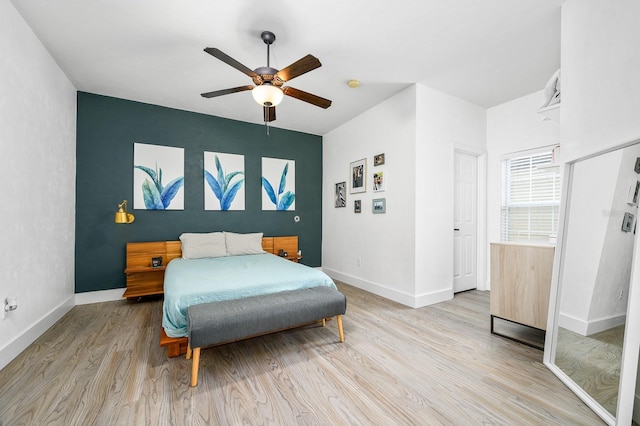 1488 NW 120th Way, Gainesville, FL 32606 - bedroom featuring baseboards, light wood-style flooring, and ceiling fan