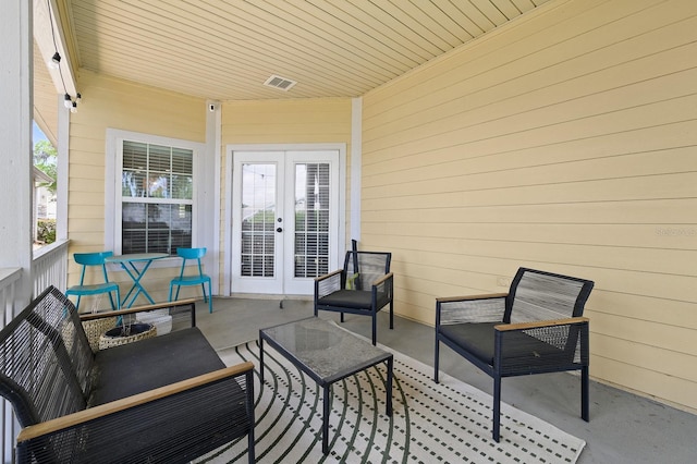 1488 NW 120th Way, Gainesville, FL 32606 - view of patio / terrace with french doors, an outdoor hangout area, and visible vents