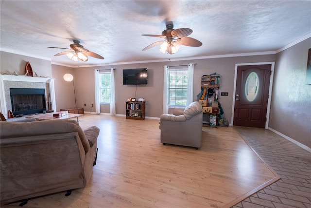 5876 SW 52nd Ter, Lake Butler, FL 32054 - living area featuring a fireplace, baseboards, ceiling fan, and ornamental molding