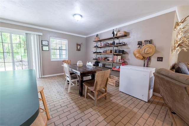 5876 SW 52nd Ter, Lake Butler, FL 32054 - dining room featuring baseboards, ornamental molding, and brick floor