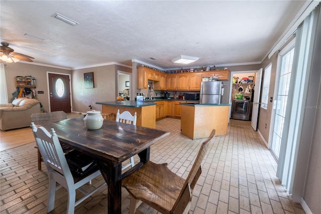 5876 SW 52nd Ter, Lake Butler, FL 32054 - dining area with washer / clothes dryer, crown molding, visible vents, and brick floor