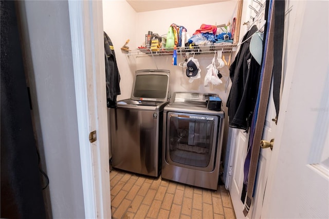 5876 SW 52nd Ter, Lake Butler, FL 32054 - clothes washing area featuring laundry area, brick patterned floor, and washing machine and clothes dryer