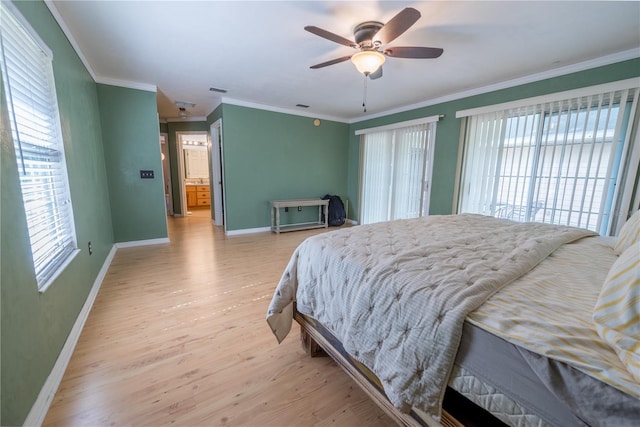 5876 SW 52nd Ter, Lake Butler, FL 32054 - bedroom with crown molding, baseboards, and light wood-style flooring