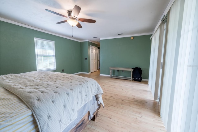 5876 SW 52nd Ter, Lake Butler, FL 32054 - bedroom with ceiling fan, visible vents, crown molding, baseboards, and light wood-style floors
