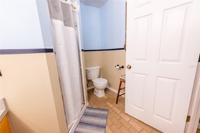 5876 SW 52nd Ter, Lake Butler, FL 32054 - bathroom featuring toilet, a shower with curtain, brick patterned floor, and baseboards