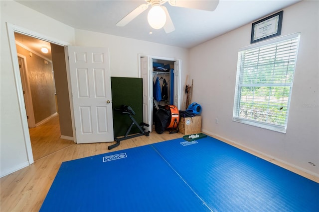 5876 SW 52nd Ter, Lake Butler, FL 32054 - exercise area featuring baseboards, light wood finished floors, and ceiling fan