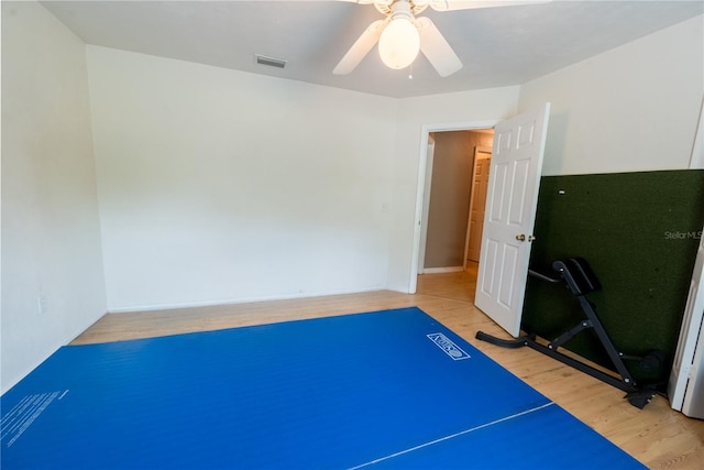 5876 SW 52nd Ter, Lake Butler, FL 32054 - exercise room featuring light wood-style floors, baseboards, a ceiling fan, and visible vents