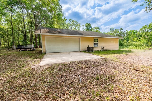 5876 SW 52nd Ter, Lake Butler, FL 32054 - ranch-style home featuring central air condition unit, an attached garage, and driveway
