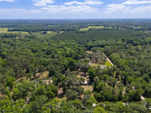 drone / aerial view with a view of trees