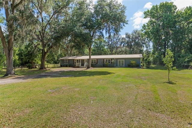 single story home with driveway and a front yard
